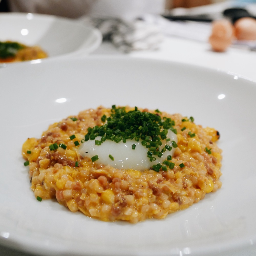 Eric's fregola with homemade vegetable stock, homemade creamed corn, grilled corn, 60 degree egg, and chives